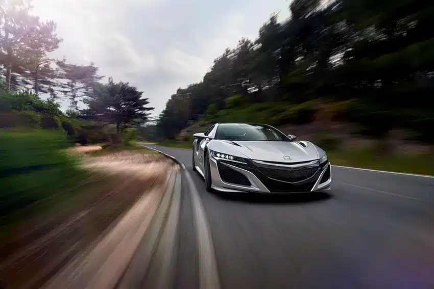 a silver mettalic Honda NSX 2015 model at medium speed
