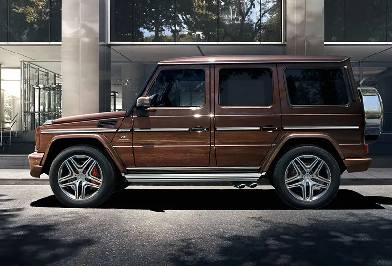 Mercedes G-Class SUV parked in a busy London city street at night