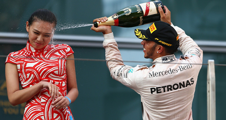 Hamilton sprays podium girl