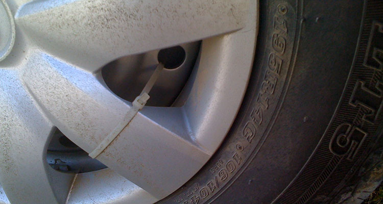 Wheelcover with cable tie