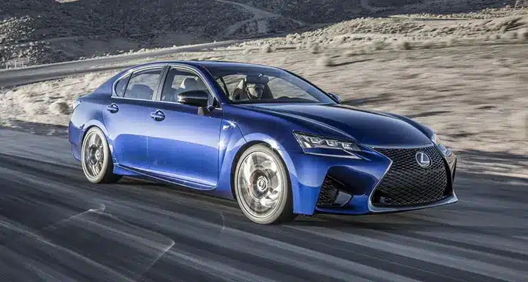 Blue Lexus GS F high performance car on a country road