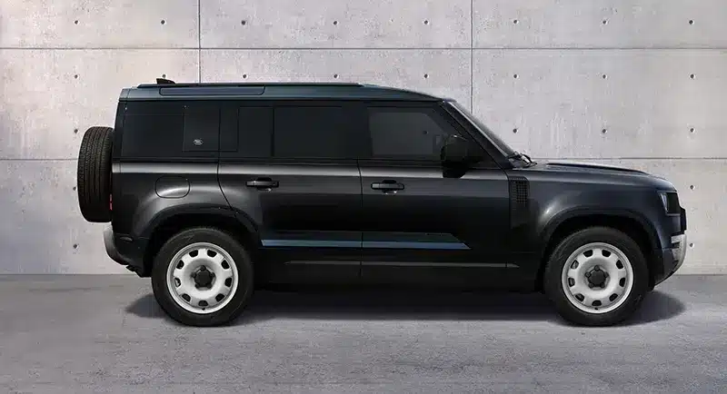 Side view of Land Rover Defender 130 V8 with County Pack showcasing classic design elements