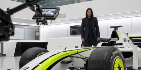 Keanu Reeves on the set of Brawn: The Impossible Formula 1 Story