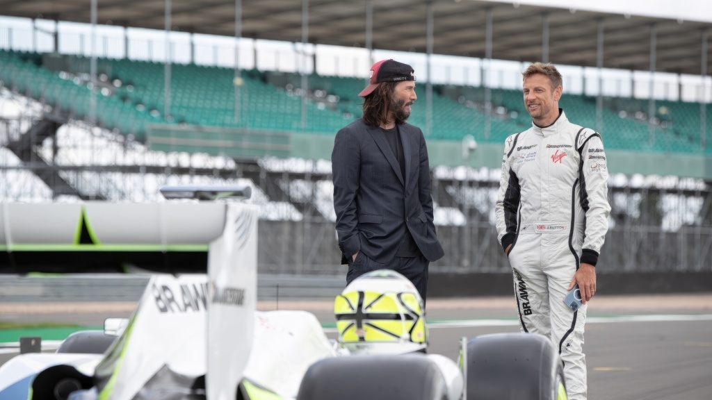 Keanu Reeves with Jenson Button on Brawn GP