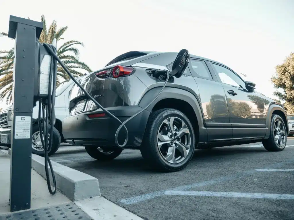 Grey Electric Car Parked on a motorway service charging Bay