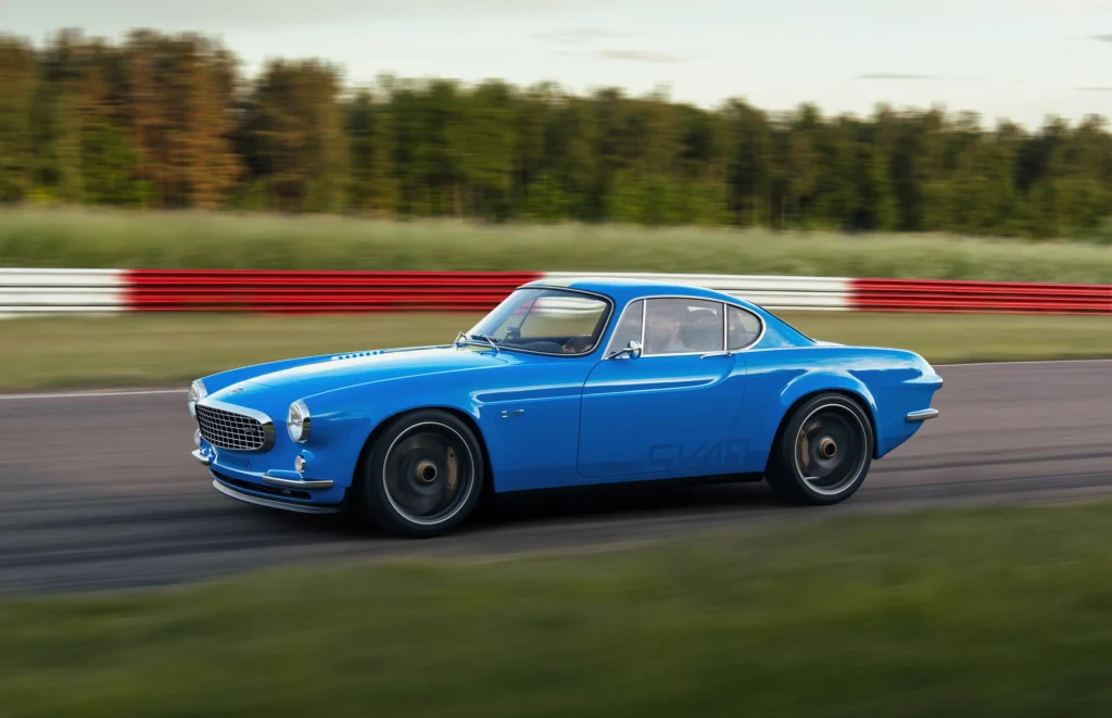 a 420bhp Volvo P1800 Cyan GT racing around a race track