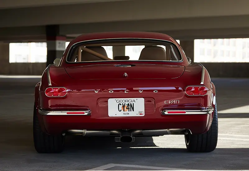 Rear view of a Volvo P1800 Cyan GT in red