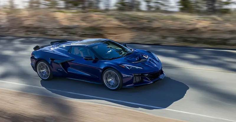 Blue 2025 Corvette ZR1 driving at speed