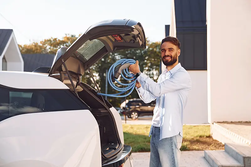 Man installing a home EV charger