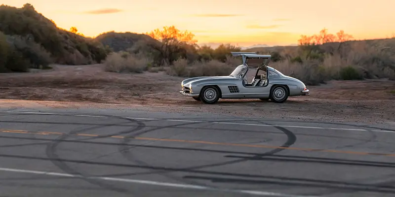 Parked in a lay-by, a rare Mercedes-Benz 300 SL Alloy Gullwing classic car