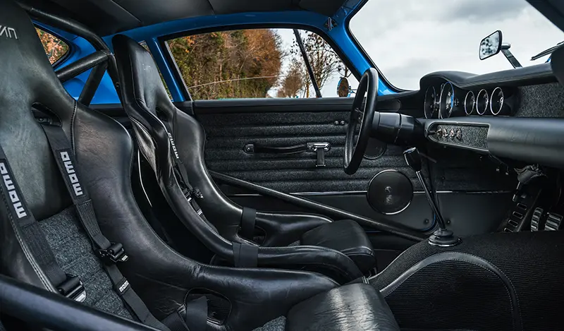 The interior of the P1800 Cyan GT features leather seats with corduroy inserts