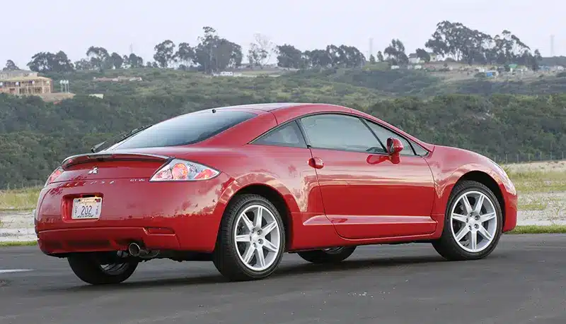 Side view of a Mitsubishi Eclipse GT V6, showcasing its sporty silhouette and aggressive stance.