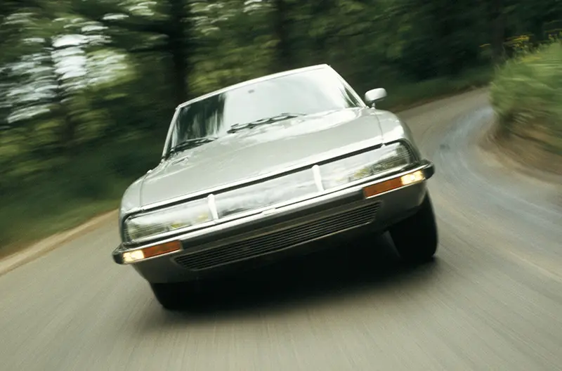 A 1955 Citroen SM on a country road