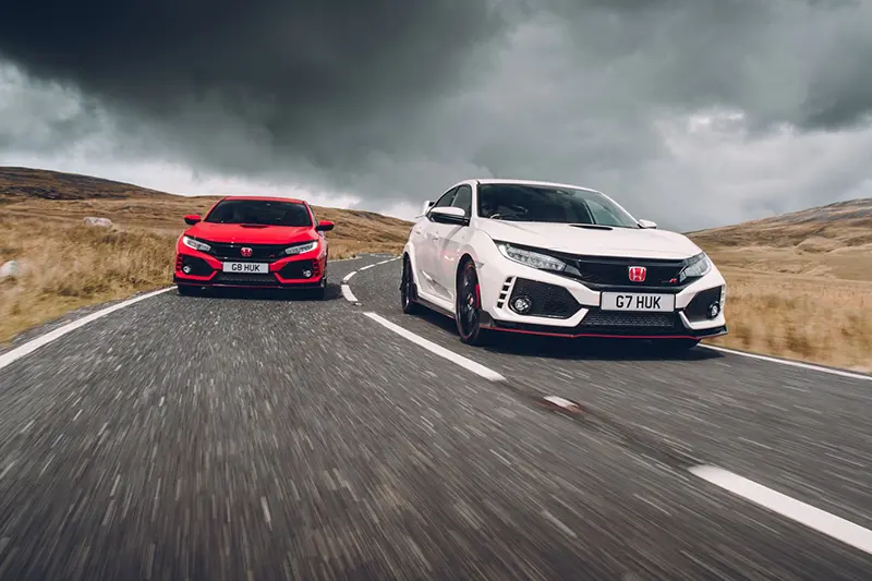 Two classic Honda Civic's on a motorway