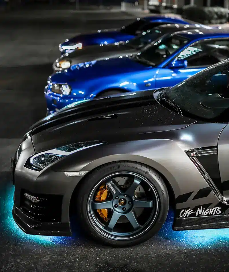 modified cars with neon under glow lighting