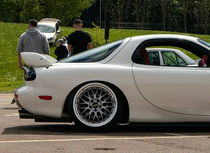 Modified Mazda RX7 at a ricer car gathering