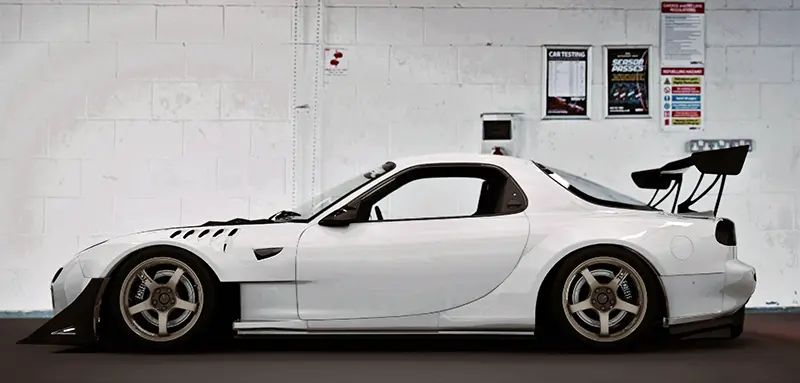 Custom Mazda RX-7 Generation 3 (FD) in a workshop