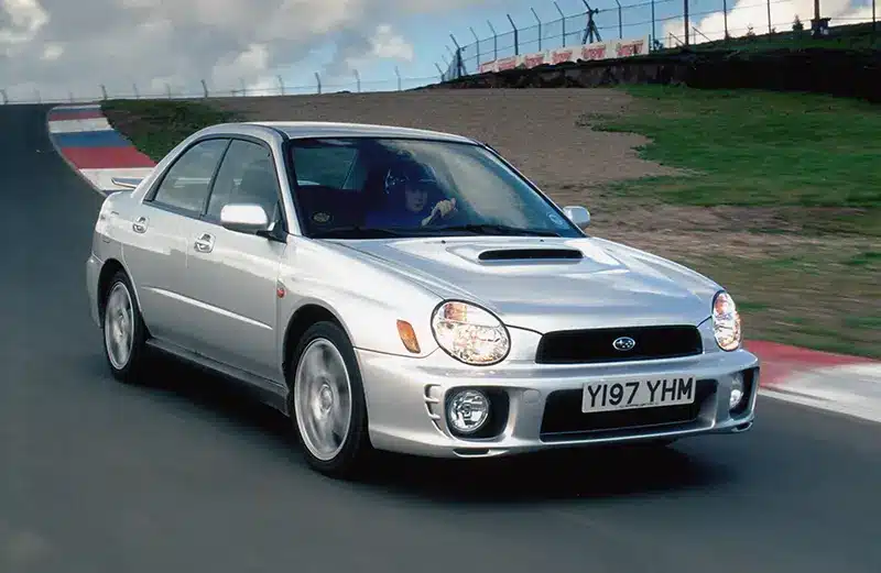 A Silver Subaru WRX Turbo at a track day event