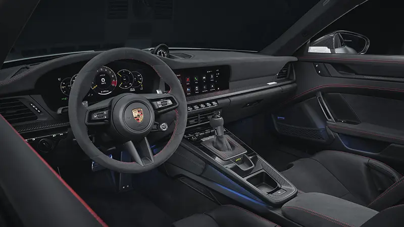 Steering wheel and dashboard view in the 2024 Porsche 911 GT Weissach Package.