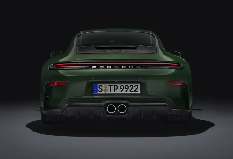 Rear view of a Green 2024 Porsche 911 GT3 with Touring Package, featuring a refined appearance.