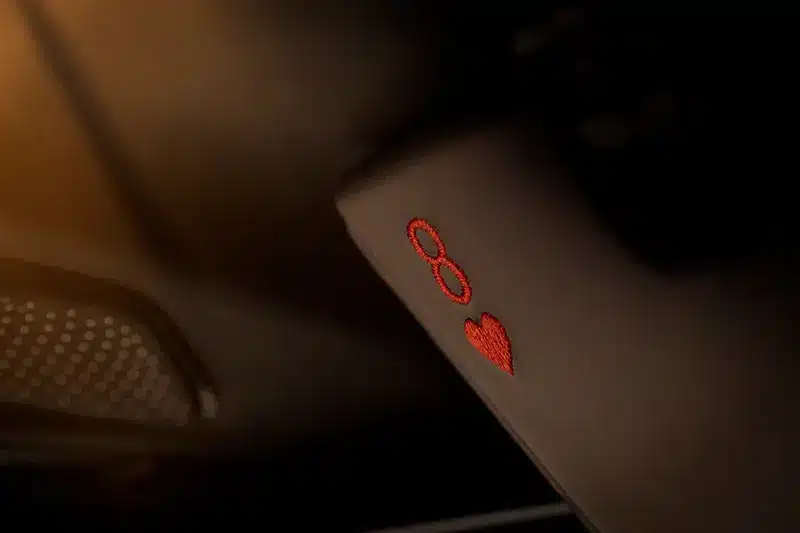 Eight of Hearts embroidery on Aston Martin DB12 Goldfinger Edition’s sun visor.