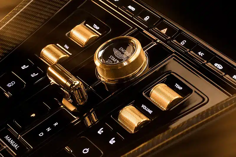 Aston Martin DB12 Goldfinger Edition interior with 18ct gold-plated rotary dial and controllers.