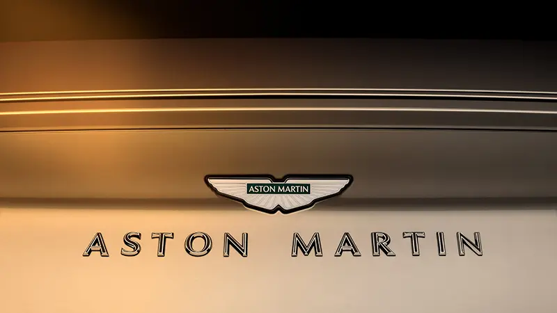 Enamelled script badges and Q fender badge on the Aston Martin DB12 Goldfinger Edition.