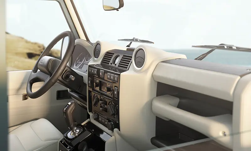 Custom Retro Classic Defender V8 interior with modern infotainment system and classic dashboard design.