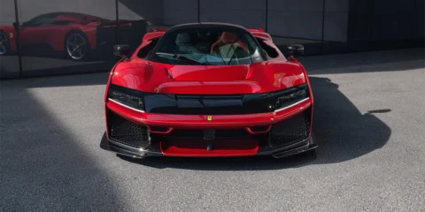 Front view of Ferrari F80 hypercar with sleek aerodynamic design and aggressive stance.