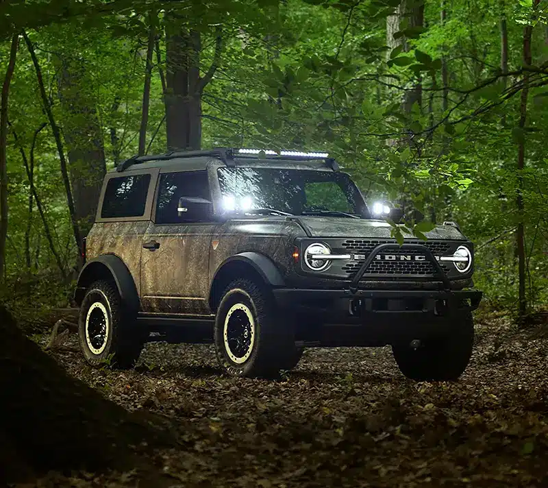 Ford Bronco Sasquatch Searcher SUV navigating forest trails in search of Sasquatch