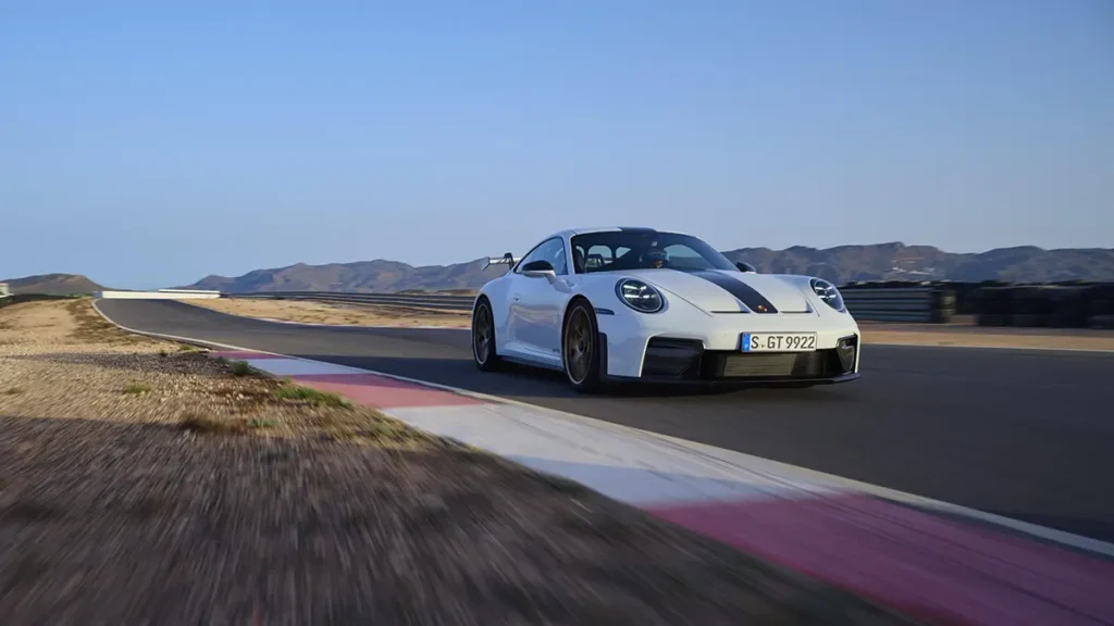 White 2024 Porsche 911 GT with Weissach Package featuring carbon-fiber components on race track testing day