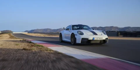 White 2024 Porsche 911 GT with Weissach Package featuring carbon-fiber components on race track testing day