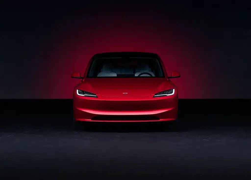 Tesla Model 3 Long Range in Ultra Red showcasing sleek design and electric performance
