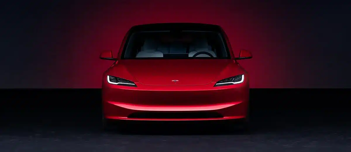 Tesla Model 3 Long Range in Ultra Red showcasing sleek design and electric performance