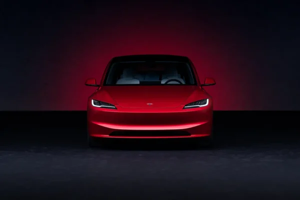 Tesla Model 3 Long Range in Ultra Red showcasing sleek design and electric performance