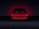 Tesla Model 3 Long Range in Ultra Red showcasing sleek design and electric performance