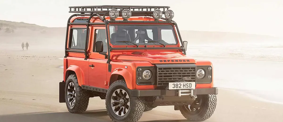 Front view of the Custom Retro Classic Defender V8, showcasing the iconic boxy design with modern LED headlights and a Heritage grille.