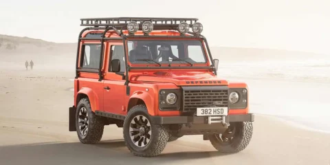 Front view of the Custom Retro Classic Defender V8, showcasing the iconic boxy design with modern LED headlights and a Heritage grille.