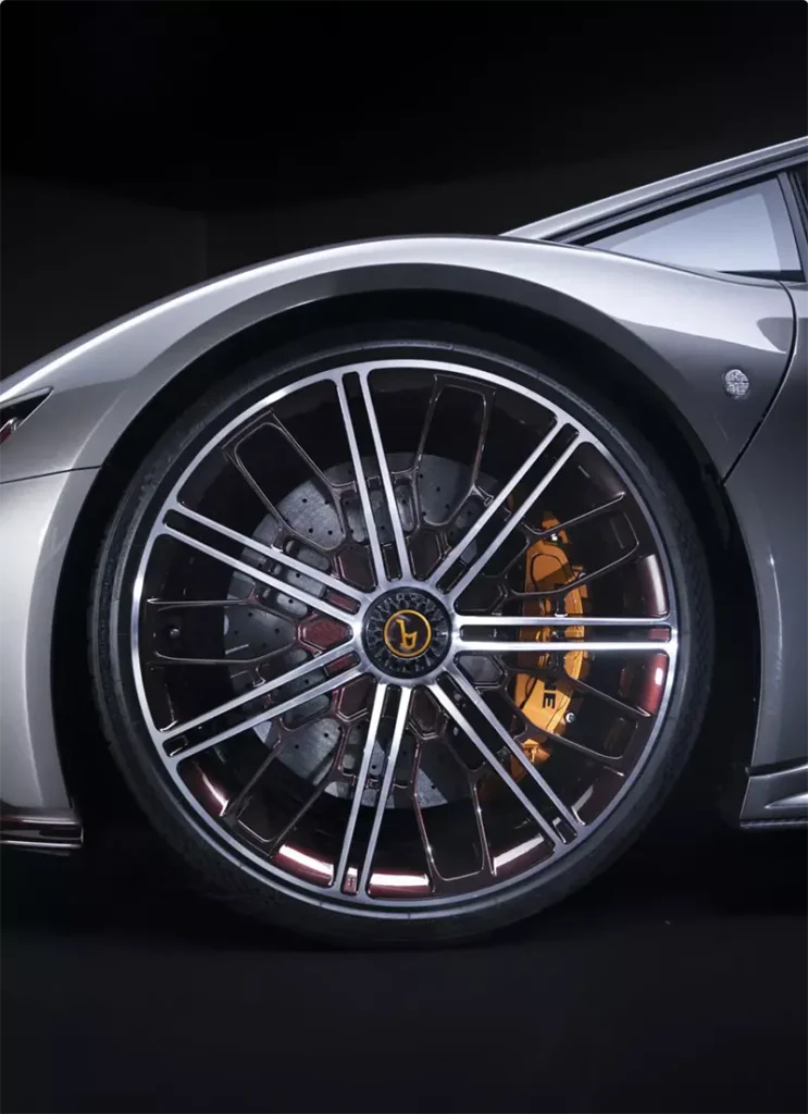 Close-up of Bertone GB110 front alloy wheel with yellow caliper