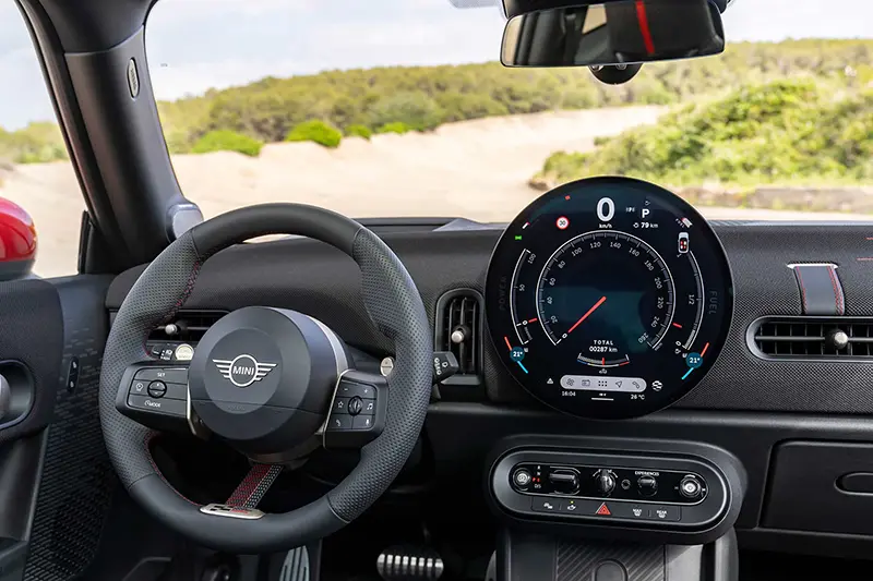 Modern dashboard of the Mini JCW, featuring premium materials and an intuitive digital display.