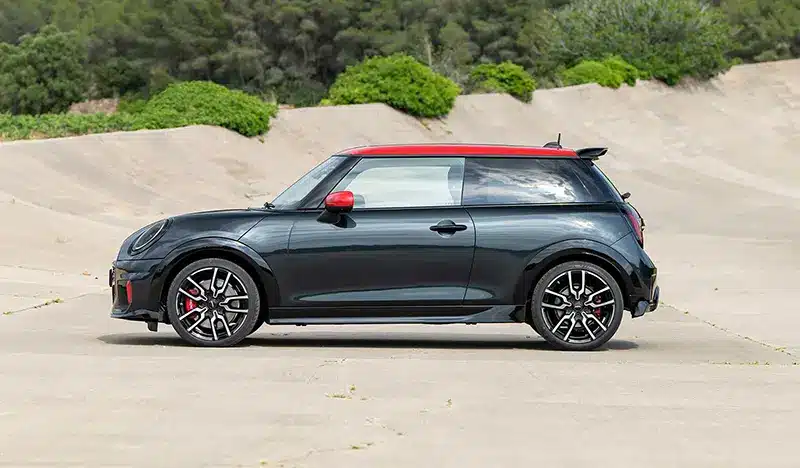 Sleek side profile of the new Mini John Cooper Works Hatchback showcasing its sporty design.