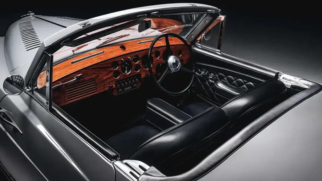 Interior of James Bond’s Bentley Locomotive showing walnut dash and black leather seats