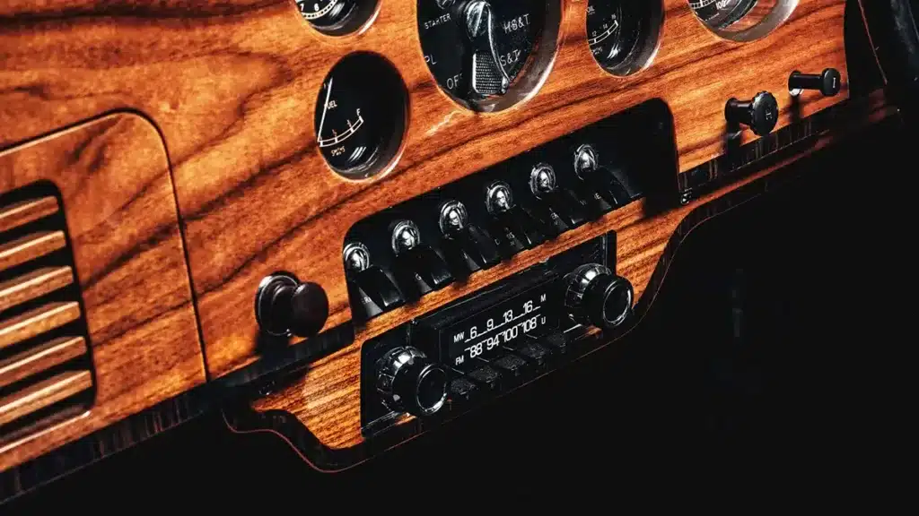Close-up of Bentley Locomotive walnut dashboard with gauges and switches