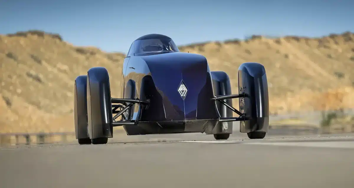 Renault Filante Record EV front view driving on open road, showcasing aircraft-inspired aerodynamic nose design