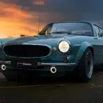 Autoforma Norrsken Volvo P1800 ES Restomod photographed from the front at sunset showing widened arches, LED lighting and classic Volvo styling