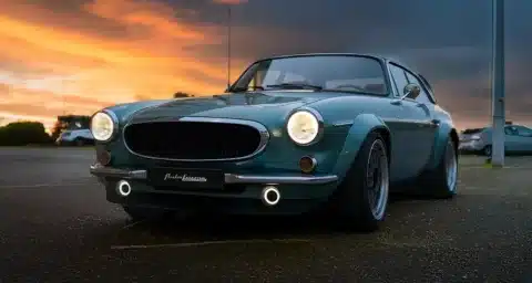 Autoforma Norrsken Volvo P1800 ES Restomod photographed from the front at sunset showing widened arches, LED lighting and classic Volvo styling