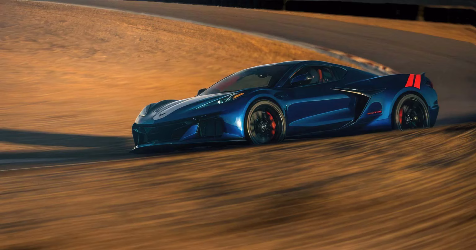 Admiral Blue 2027 Chevrolet Corvette Grand Sport pulling out of a desert corner at speed