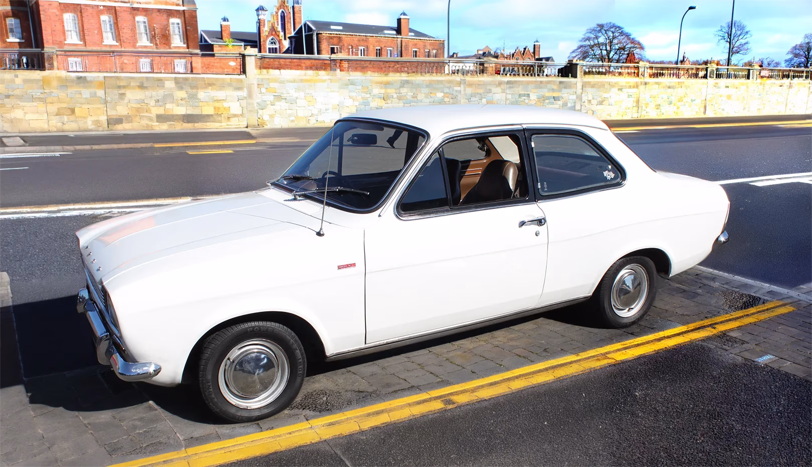 White original Ford Escort Mk1 1300 XL parked beside a road
