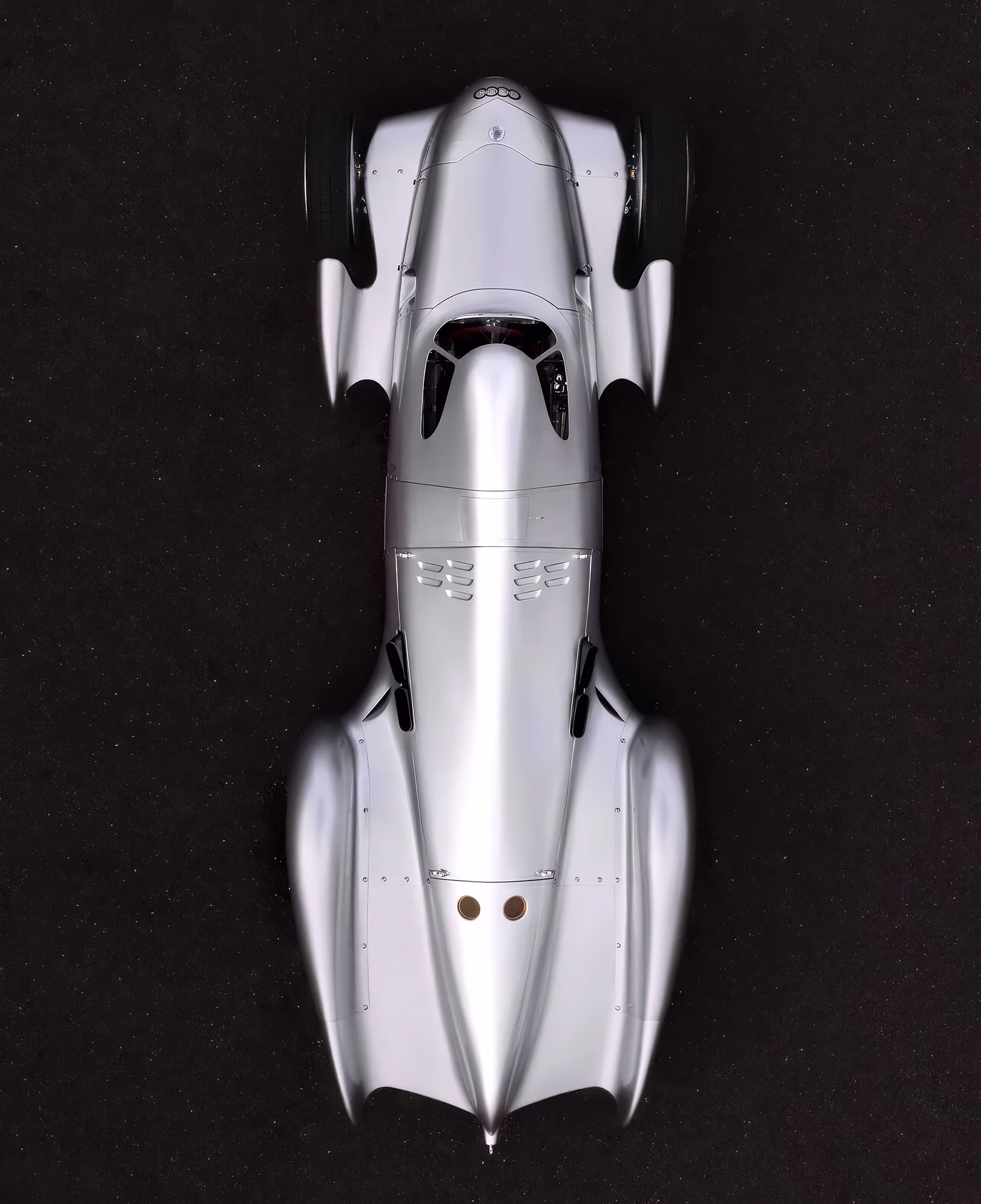 Full overhead view of the silver Auto Union Lucca against a dark background