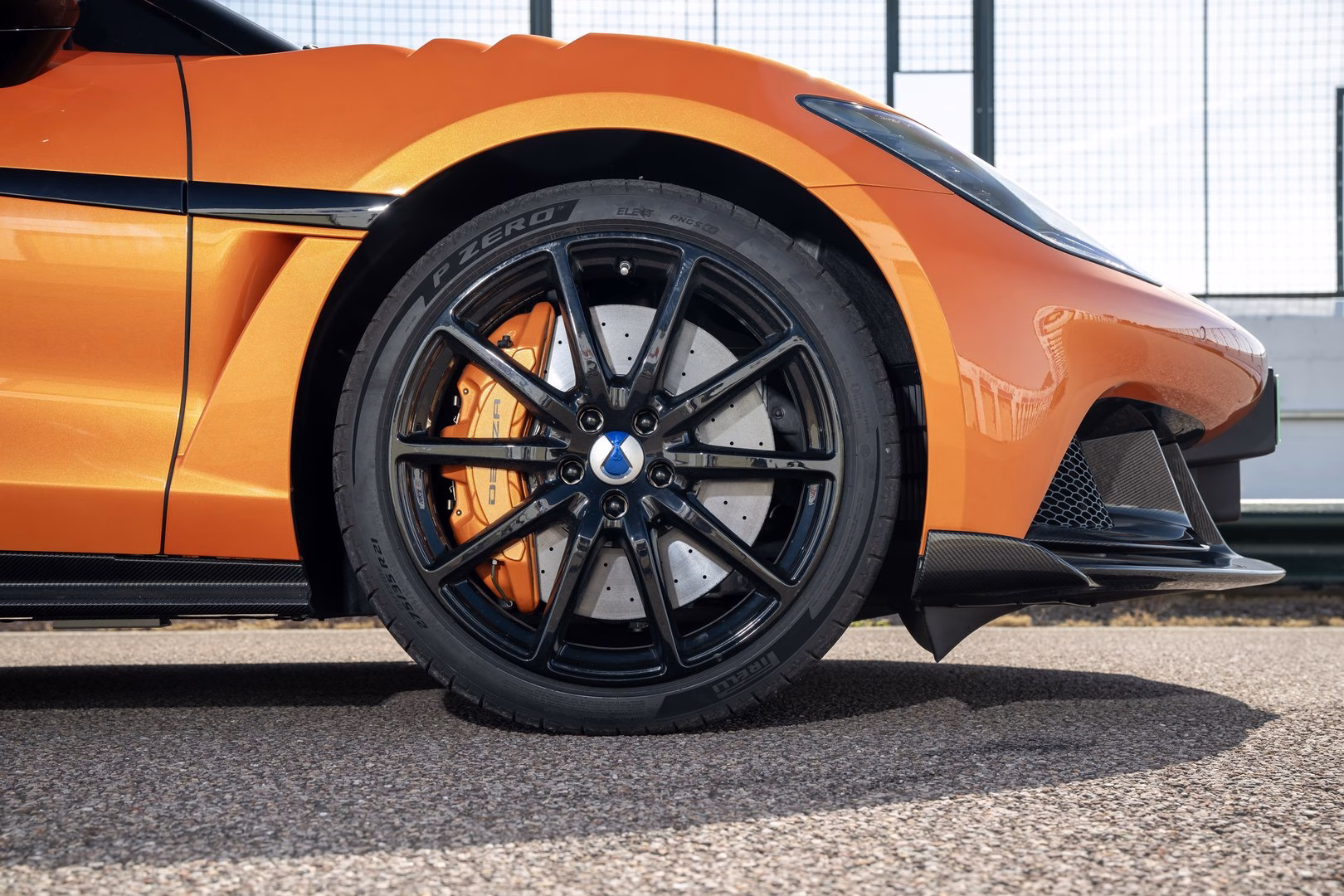 Close-up of a BYD Denza Z wheel with orange caliper and carbon-ceramic disc on Pirelli P Zero tyres